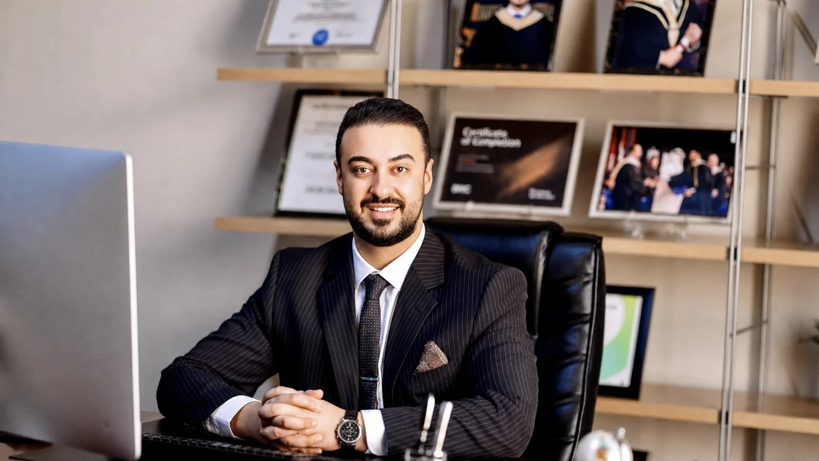Ali Owji seated at his desk in the Trustline Digital office in Dubai.